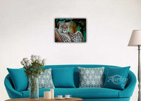 Leopard Perched in the Treetops